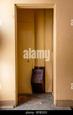 Old garbage chute in apartment building with cheap apartments - Rubbish chute in a Soviet block of flats Stock Photo