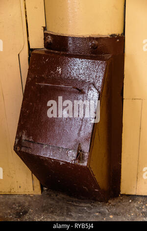 Old garbage chute in apartment building with cheap apartments - Rubbish chute in a Soviet block of flats Stock Photo