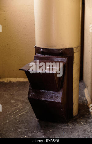 Old garbage chute in apartment building with cheap apartments - Rubbish chute in a Soviet block of flats Stock Photo