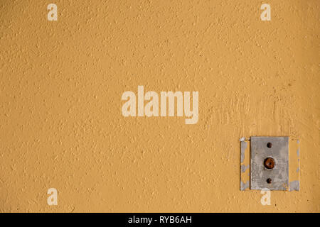 Old elevator call button with grungy pattern in a soviet building in post-soviet Riga, Latvia Stock Photo