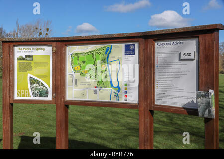 Notice board by car park at end of South Walk in the sunshine showing map information and advice in Oxford University Parks in winter / spring Stock Photo