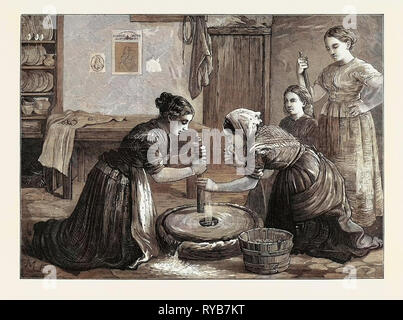 Women Grinding Corn in Ireland, 1874 Stock Photo