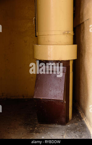 Old garbage chute in apartment building with cheap apartments - Rubbish chute in a Soviet block of flats Stock Photo