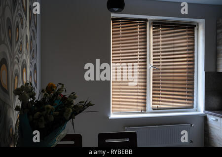 Interior room with wooden shutters on the window. Stock Photo