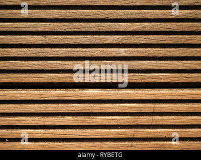 Closeup of the wooden slats of decking board for use as a background Stock Photo
