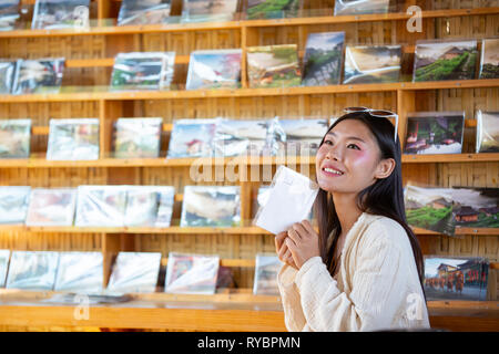 Female tourists spread their arms and held their wings, smiling happily. Stock Photo