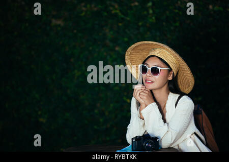 Female tourists spread their arms and held their wings, smiling happily. Stock Photo