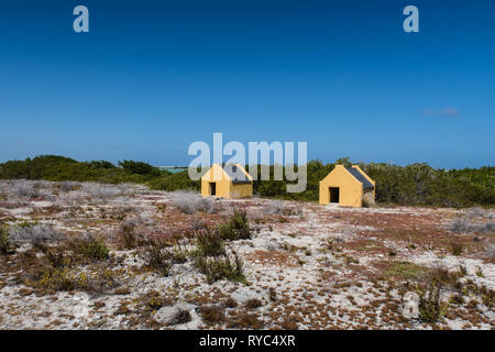 Historical slave huts of the salt mine workers near the salt pan on the tropical island of Bonaire in the Netherlands Antilles Stock Photo