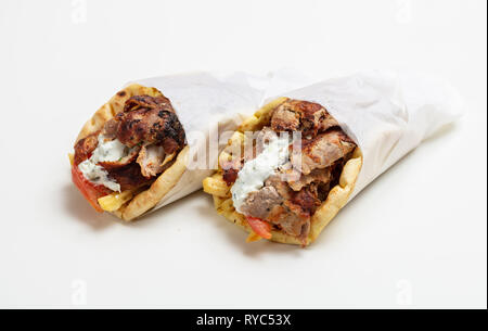 Gyro pita, shawarma, take away, street food. Two pita bread wraps with meat, traditional greek turkish food isolated on white background Stock Photo