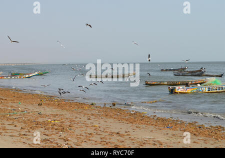 Artisanal pirogues at the beach of Djiffère, Senegal Stock Photo