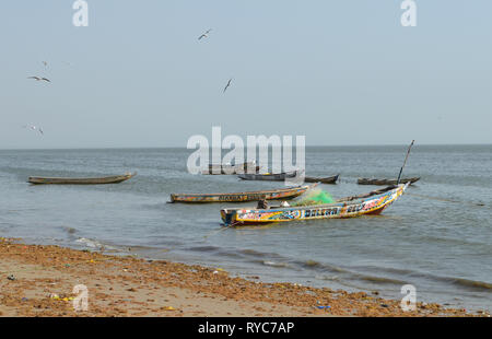 Artisanal pirogues at the beach of Djiffère, Senegal Stock Photo