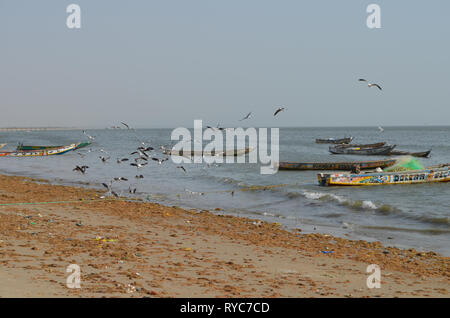 Artisanal pirogues at the beach of Djiffère, Senegal Stock Photo