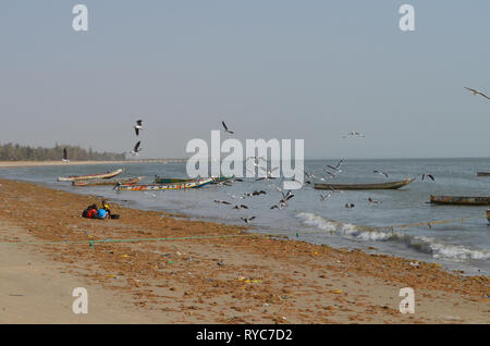 Artisanal pirogues at the beach of Djiffère, Senegal Stock Photo