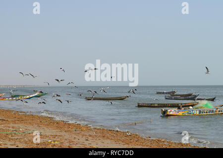 Artisanal pirogues at the beach of Djiffère, Senegal Stock Photo