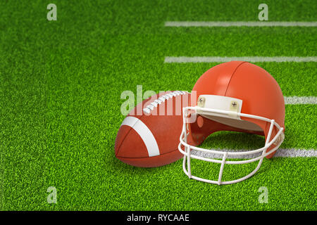 3d rendering of american football ball and helmet on green field background Stock Photo