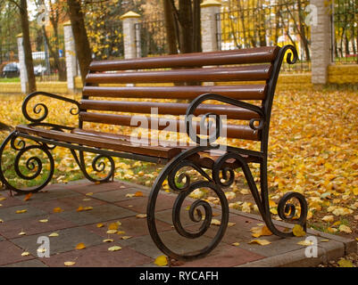 beautiful wooden bench in the Park in autumn, Moscow Stock Photo