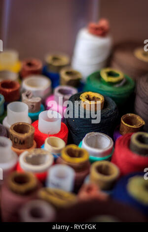 many spools of thread. multi-colored thread. preparation for sewing. needlework. hobby. Stock Photo
