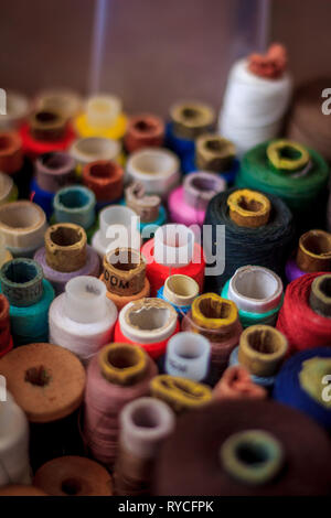 many spools of thread. multi-colored thread. preparation for sewing. needlework. hobby. Stock Photo