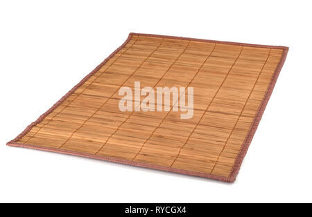 Bamboo sushi mat isolated on white background. Traditional Japanese or Chinese table setting. Stock Photo