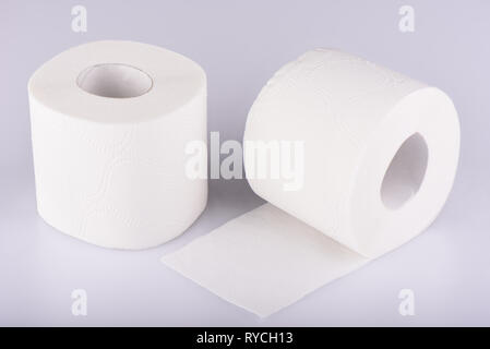 Two rolls of white toilet paper isolated. The paper product used in the sanitary and hygienic purposes. Stock Photo