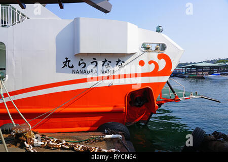 MIYAJIMA, JAPAN -26 FEB 2019- View of a ferry transporting visitors to the Japanese island of Itsukushima (Miyajima) in the Hiroshima Bay, Japan. Stock Photo