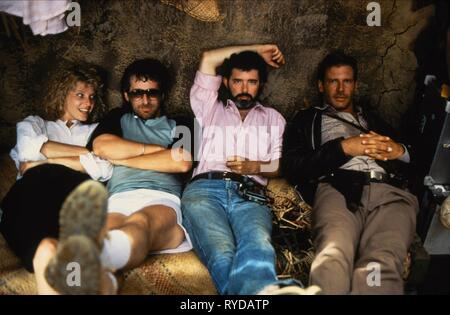 KATE CAPSHAW, STEVEN SPIELBERG, GEORGE LUCAS, HARRISON FORD, INDIANA JONES AND THE TEMPLE OF DOOM, 1984 Stock Photo