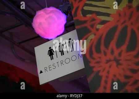 A transgender bathroom sign inside of an art exhibit titled Meow Wolf in Santa Fe, New Mexico. Stock Photo