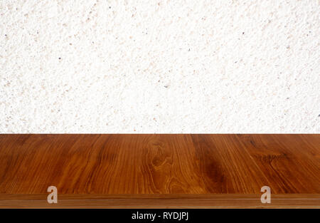 Tan wooden table on white background of cement wall textured- can be used for display or montage your product Stock Photo