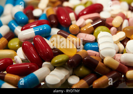 Different colored medicine and types of pills. Medical health or drugs addiction concept Stock Photo