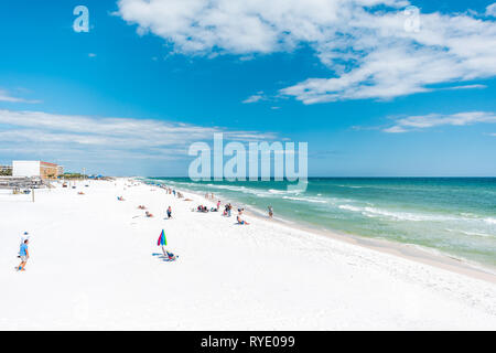 Fort Walton Beach, USA - April 24, 2018: Okaloosa Island in Florida in Panhandle Gulf of Mexico during sunny day with coastline buildings, people and  Stock Photo