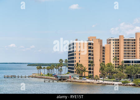 Fort Myers, USA - April 29, 2018: City cityscape skyline with apartment buildings during sunny day in Florida gulf of mexico coast and bay view from S
