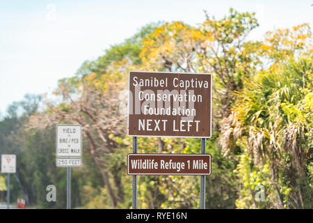 Sanibel Island, USA - April 29, 2018: Captiva Conservation Foundation sign and national wildlife refuge park by beach and road in Fort Myers, Florida  Stock Photo