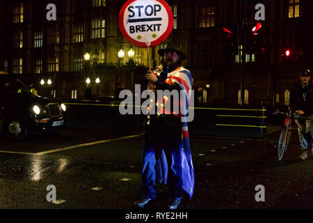 London, UK. 12th March 2019. Protests both for and against Brexit continue to take place on College Green outside the British Parliament in London. Stock Photo