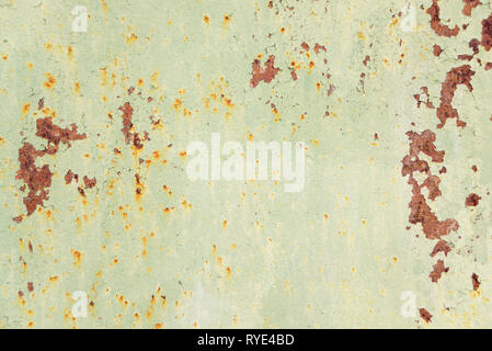Multicolored abstract background: old rusty metal surface with blue paint flaking and cracking texture Stock Photo