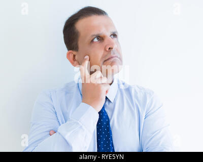 Middle age man thinking clueless about a question Stock Photo