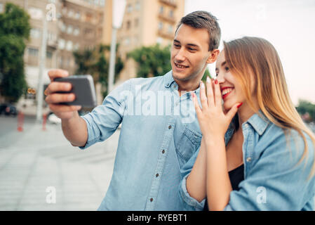 Phone addiction, couple looking on smartphone Stock Photo