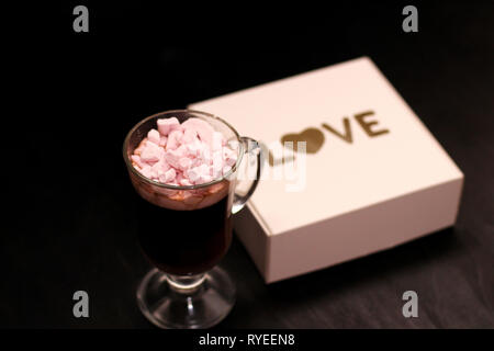 hot drink in a glass cup with pink marshmallows Stock Photo