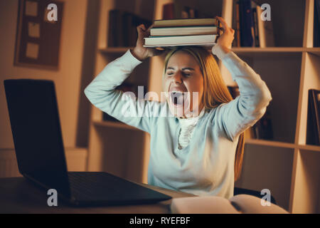 Student has too much to learn at home. Stock Photo