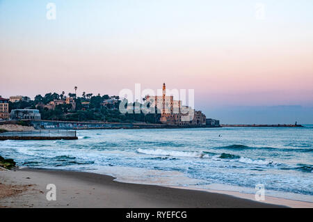 Israel, Jaffa as seen from the North at dawn. the old port on the right and the belfry of the Church and Monastery of St Peter in the centre Stock Photo