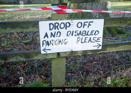 A wooden disabled sign in the countryside Stock Photo - Alamy