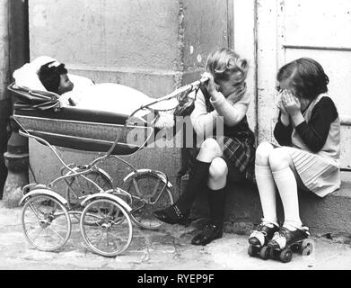 people, children, playing, two little girls with pram and skates, Cologne, 1960s, Additional-Rights-Clearance-Info-Not-Available Stock Photo