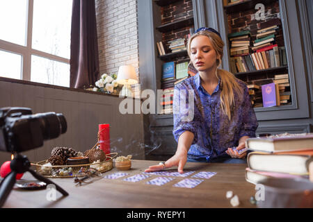 Smart young woman having a fortune telling session Stock Photo