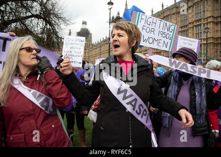 WASPI women protest joins in the Anti Brexit demonstration after breaking through the barriers onto College Green in Westminster on the day after the ‘meaningful vote’ when MPs again rejected the Prime Minister’s Brexit Withdrawal Agreement and before a vote on removing the possibility of a No Deal Brexit on 13th March 2019 in London, England, United Kingdom. Women Against State Pension Inequality is a voluntary UK-based organisation founded in 2015 that campaigns against the way in which the state pension age for men and women was equalised. They call for the millions of women affected by the Stock Photo