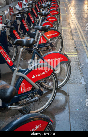 A line of Santander hire bikes in Soho, London. Stock Photo