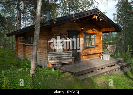 Wooden chalet in the forest at Engholm Husky Lodge, Karasjok, Finnmark County, Norway Stock Photo
