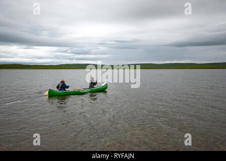 Canoeing in Nattvann lake, Karasjok, Finnmark County, Norway Stock Photo