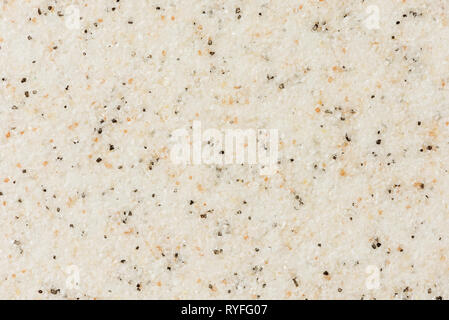 Natural background: empty flat surface of small multi-colored marble grains Stock Photo