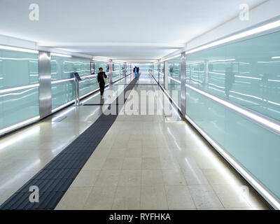 BRESCIA, ITALY - FEBRUARY 21, 2019: passengers in subway at the railway station of Brescia city in evening. Brescia is the second largest city in Lomb Stock Photo