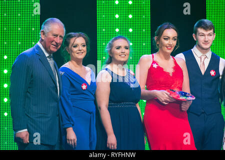 The Prince of Wales with winner of the Community Impact award Team 34 onstage at the annual Prince's Trust Awards at the London Palladium. Stock Photo