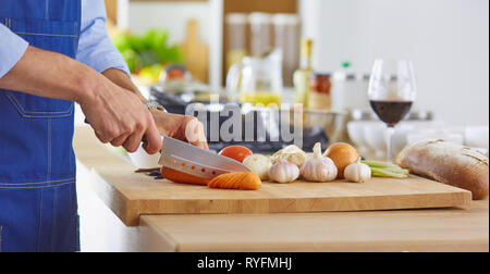 Young chef prepares a man in the kitchen Stock Photo